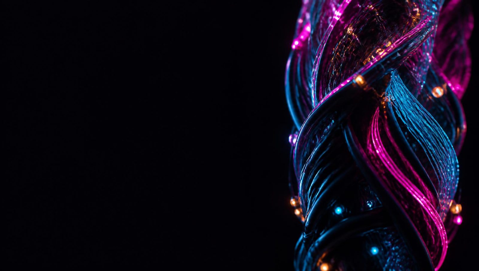 A braided bundle of glowing magenta and cyan fibre against black